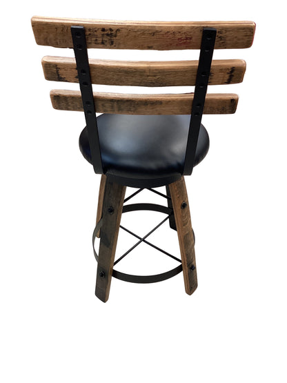 Whiskey barrel table with 2 barstools.